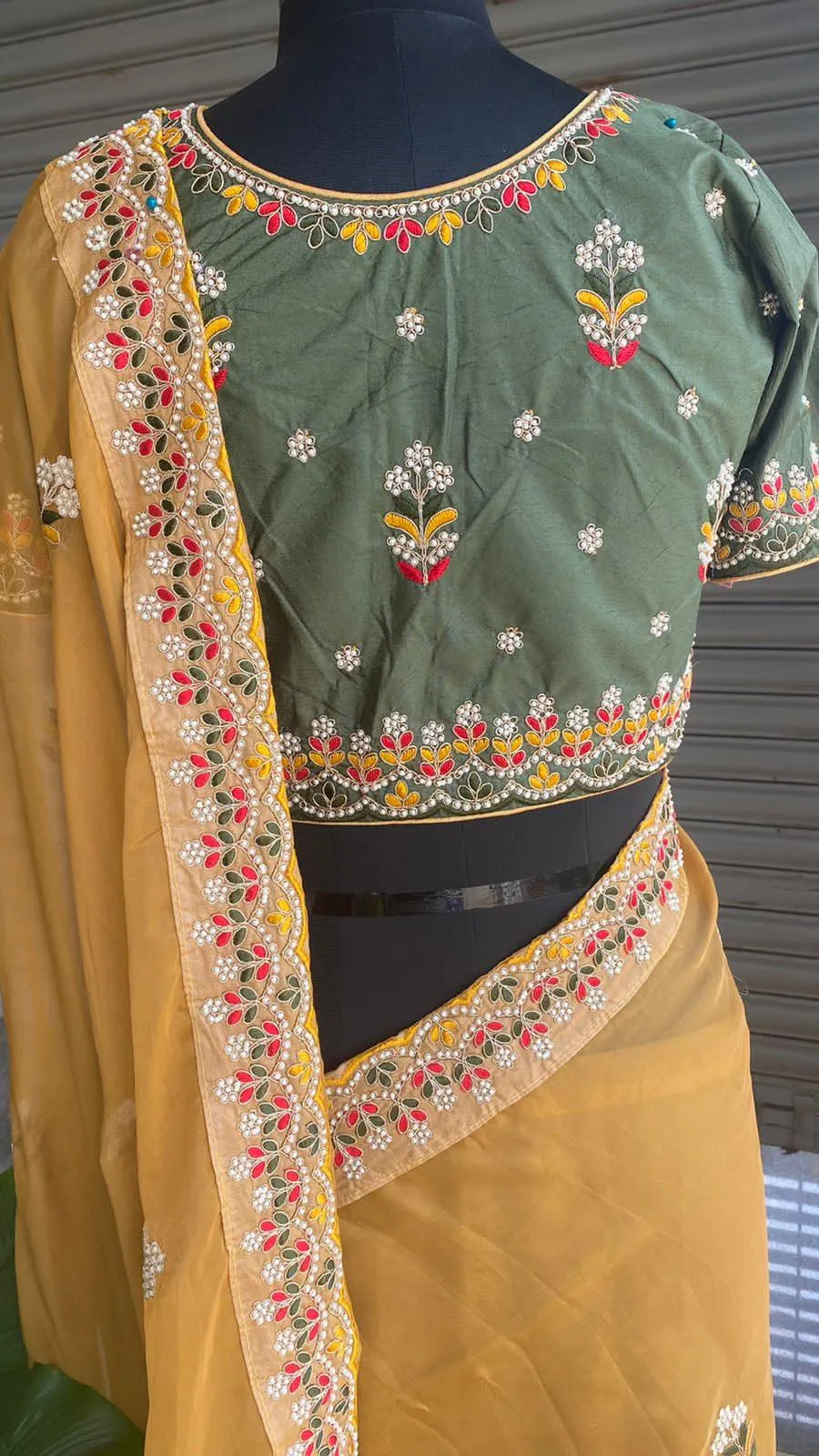 Light orange organza saree with silk embroidery blouse