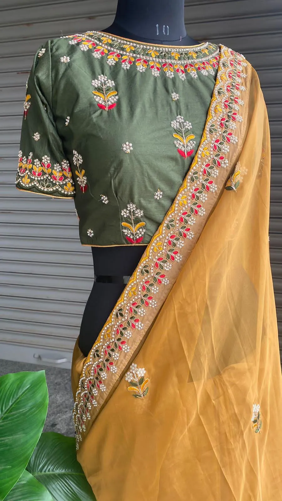 Light orange organza saree with silk embroidery blouse